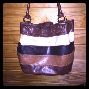 Axcess brand multi colored leather bag.